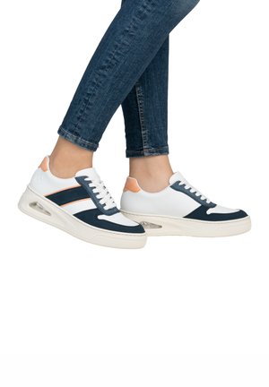 White and navy-blue sneakers with orange accents, featuring a textured upper, padded collar, and clear air cushioning in the sole.