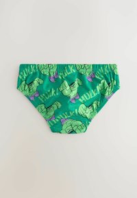 Gröna kalsonger för barn med elastiskt midjeband, prydda med flera tryckta Hulk-karaktärer och texten "HULK!" i livfulla färger.