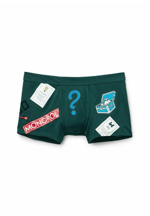 Green cotton boxer shorts featuring a blue question mark and Monopoly-themed graphics, including cards and a treasure chest design.