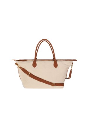 Canvas bag with brown leather straps and handles, featuring a zip closure and an adjustable shoulder strap, displayed against a white background.