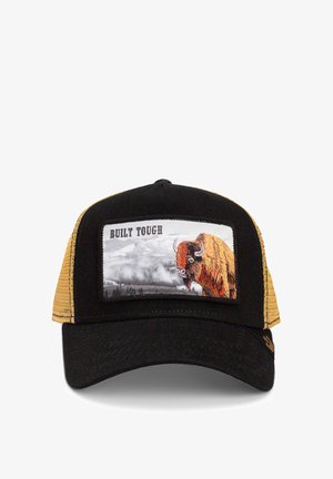 Gorra trucker negra y mostaza con un gráfico de bisonte y el texto "CONSTRUIDO PARA DURAR" en un parche. Se pueden ver la textura de la tela y la forma estructurada.