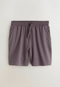 Szürke sportnadrág, puha, légáteresztő anyagból készült. Rugalmas derékrésszel, húzózsinórral és oldalzsebekkel rendelkezik.