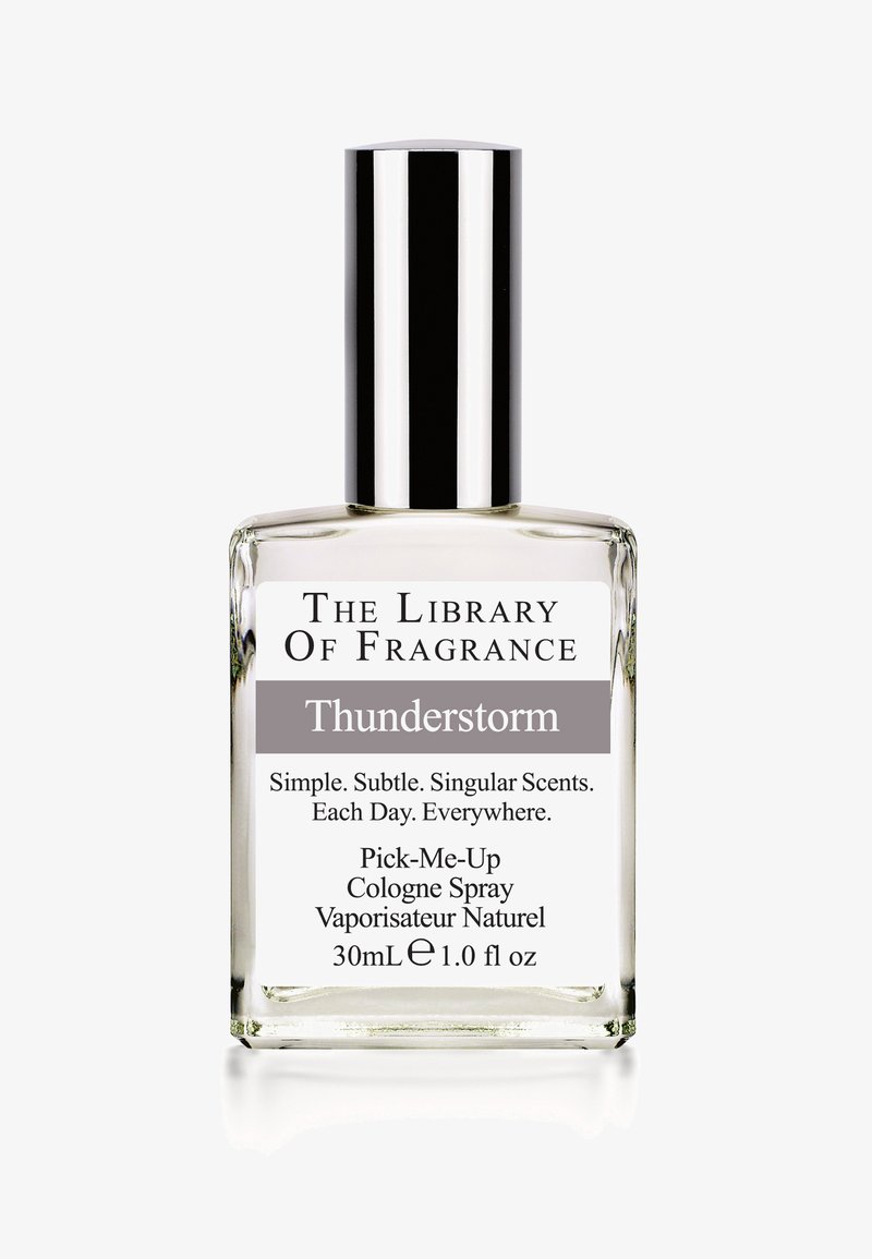 Bouteille de cologne en verre clair avec un capuchon en argent, étiquetée "Thunderstorm", 30 mL, avec un texte en noir et gris sur un fond blanc.