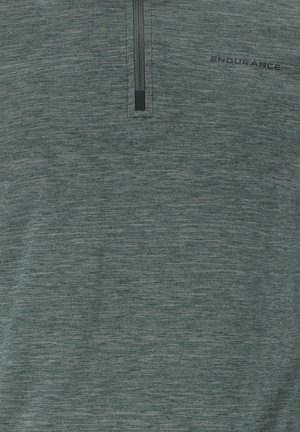 Vihreä, kevyt vetoketjullinen neule, jossa on neljänneksen vetoketju. Ominaisuuksiin kuuluu teksturoitu kangas, jossa on hillitty heatherointi ja musta "ENDURANCE"-logo.