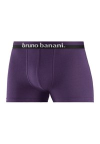 Paarse boxershorts van zacht materiaal, met een zwarte tailleband waarop het witte "bruno banani" logo staat. Het ontwerp heeft een frontale pouch en een aangesloten pasvorm.