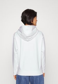 Levi's® GRAPHIC STANDARD HOODIE - Sweatshirt com capuz - bright white
