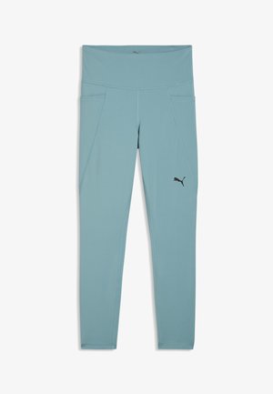Leggings de sport bleu clair taille haute avec poches latérales et petit logo Puma noir sur la cuisse droite.