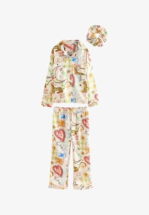 Long-sleeve pajama set in light fabric featuring multicolored patterns of hearts, suns, and animal prints. Includes matching scrunchie.