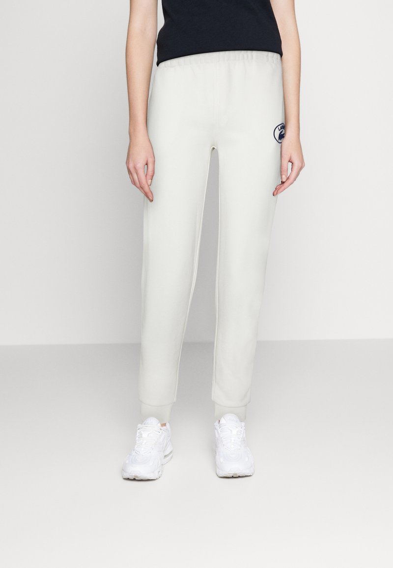 Lacoste Tracksuit bottoms blanc/offwhite Zalando.de