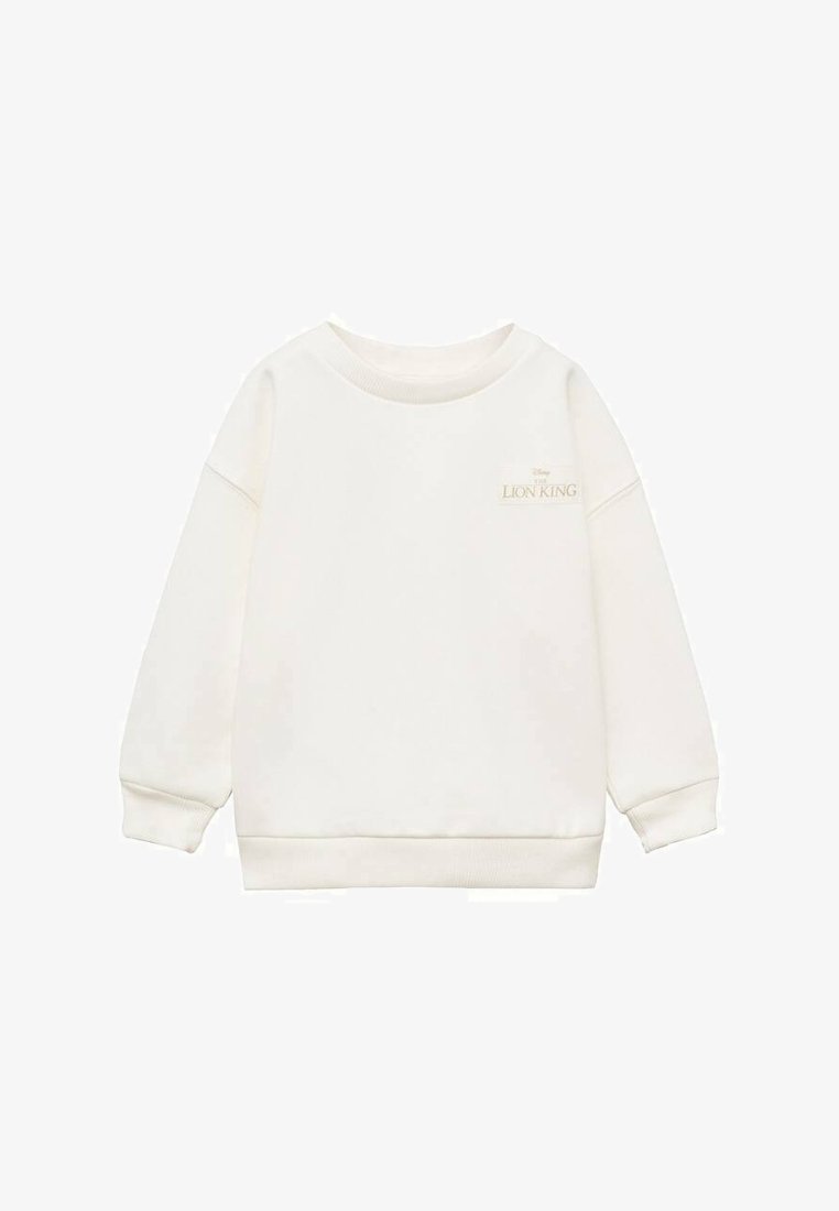 Bela majica s dolgimi rokavi iz mehkega blaga, z okroglem ovratnikom in majhnim zlatim logotipom "Lion King" na sprednji strani.