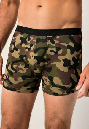 Boxershorts mit Camouflage-Muster in Grün, Braun und Schwarz, aus weichem Stoff mit einem schwarzen, bedruckten Bund. Enganliegende Passform mit sichtbaren Nähten.