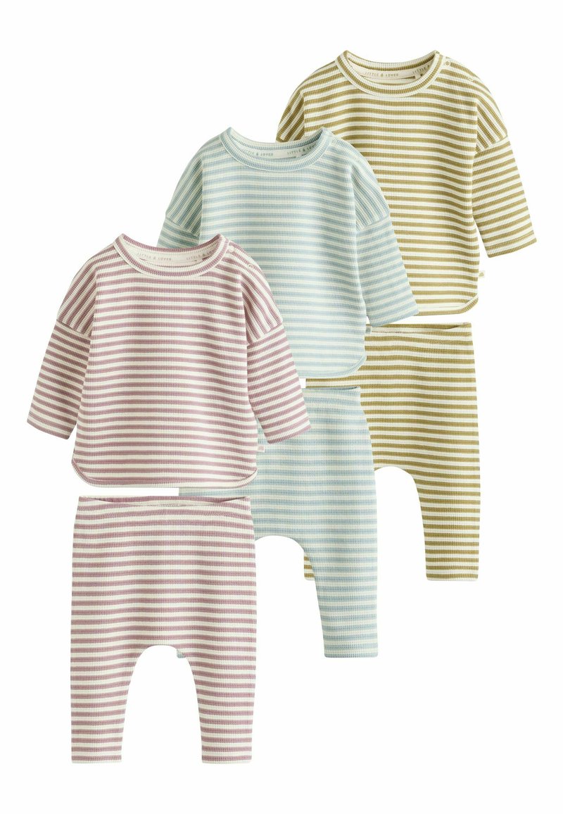 Four sets of toddler outfits in varying pastel stripes. Reversible tops with long sleeves and matching bottoms, featuring ribbed texture and soft materials.