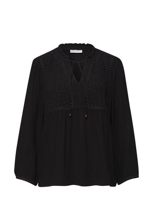 Musta pitkähihainen pusero, jossa rintakappaleessa kukallinen leikkaustyö ja kirjailu, pyöreä pääntie avaimenreikäyksellä ja nauhoilla, väljä istuvuus.