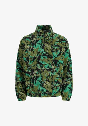 Fliisist pullover rohelises, mustas ja türkiissinises kamuflaažimustris. Omab kõrget kaelaosa ja pooltõmbluku sulgemist. Tekstureeritud, pehme kangas.