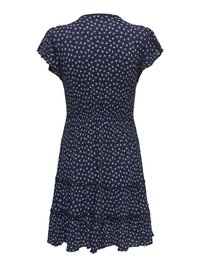 Robe bleu marine à manches courtes avec petit motif floral blanc et jupe à volants superposés, vue de dos.