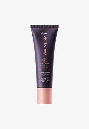 Dyson pre-style cream tube, 30 mL, with dark purple body, pink cap, and embossed text. Designed for light conditioning of curly to coily hair.