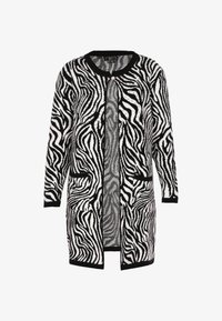 Nevybrané, schwarz wollweiss