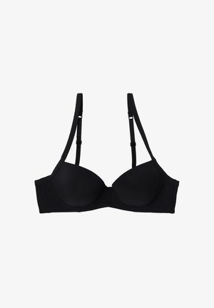 Soutien-gorge noir avec armatures, cups moulés lisses, bretelles ajustables et détails de couture subtils. Fabriqué en tissu extensible pour plus de confort.