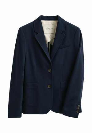 Marineblauer maßgeschneiderter Blazer mit zwei vorderen Knöpfen, zwei aufgesetzten Taschen unten, einer Brusttasche mit Paspelierung und Revers mit Kerbe.