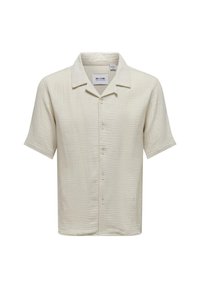 Short-sleeved shirt in light beige, featuring a textured fabric with a button closure and a classic collar. Label visible inside the collar.