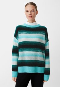 Striped sweater in teal, black, and white; soft knit material with a relaxed fit, ribbed cuffs, and neck; features wide horizontal stripes.