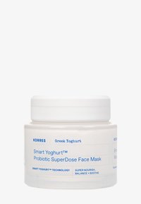 Masque facial Korres Greek Yoghurt Smart Yoghurt Probiotic SuperDose dans un pot blanc avec du texte bleu, promouvant la nutrition, l'équilibre et des effets apaisants.