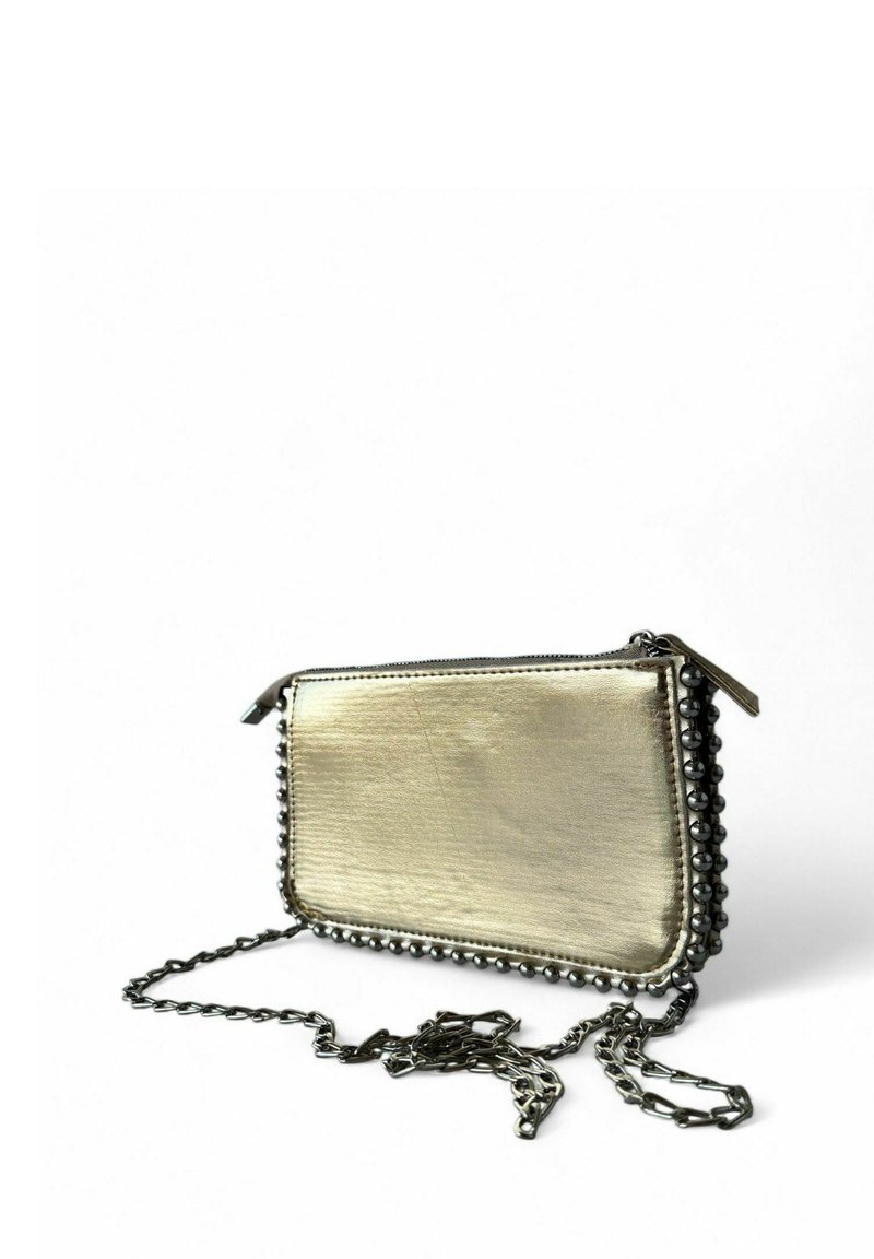 Metallic gold clutch bag with a textured finish, featuring black bead detailing along the edge and a chain strap for carrying.