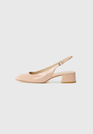 Patent slingback shoe in light pink, featuring a pointed toe, a block heel, and an adjustable strap with a silver buckle detail.