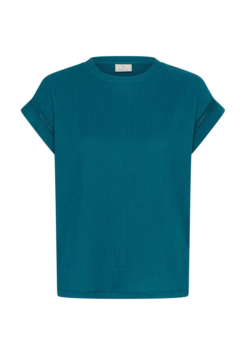 Haut en maille texturée à manches courtes couleur sarcelle avec encolure ronde et manches retroussées, présenté sur fond blanc uni.