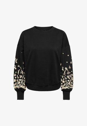 Juoda palaidinė su ilgomis rankovėmis, papuošta kreminių spalvos gėlių siuvinėjimu ant rankovių ir raukiniais ant rankogalių, pagaminta iš minkštos, tekstūrinės medžiagos.