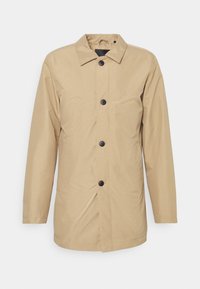 Beige outerwear jacket made of lightweight fabric, featuring a button-up front, pointed collar, and long sleeves with a relaxed fit.