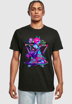 Black cotton t-shirt featuring a vibrant, graphic print of an illustrated figure with pink hair, surrounded by stylized elements and patterns.