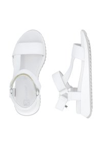 Sandales blanches en matériau synthétique, avec deux larges brides traversant le pied, une bride de cheville et une semelle texturée pour une bonne adhérence.