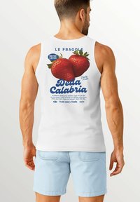 White sleeveless tank top featuring a graphic print of two strawberries and text in blue and black, with a smooth cotton texture.