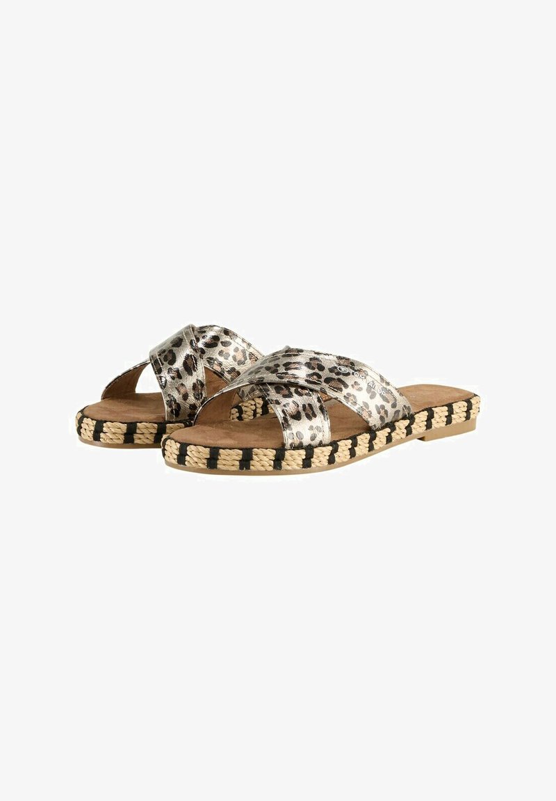 Espandrille-Sandalen mit gekreuztem Riemendesign in metallic silbernem Leopardenmuster. Mit Jutesohle und schwarzen Akzenten sowie einem weichen braunen Fußbett.