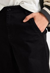Lindex WILMER WIDE LEG - Chinos - black