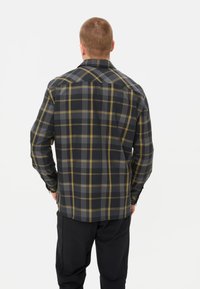 Camicia a quadri nera e grigia con accenti gialli, caratterizzata da maniche lunghe, orlo dritto e colletto classico. Progettata con una vestibilità rilassata.