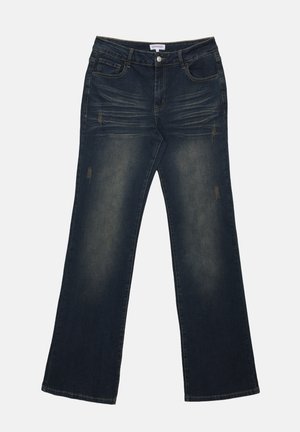 Mörkblå denimjeans med avslappnad passform, med förslitningar, framfickor och knäppning. Slitna detaljer synliga på benen.