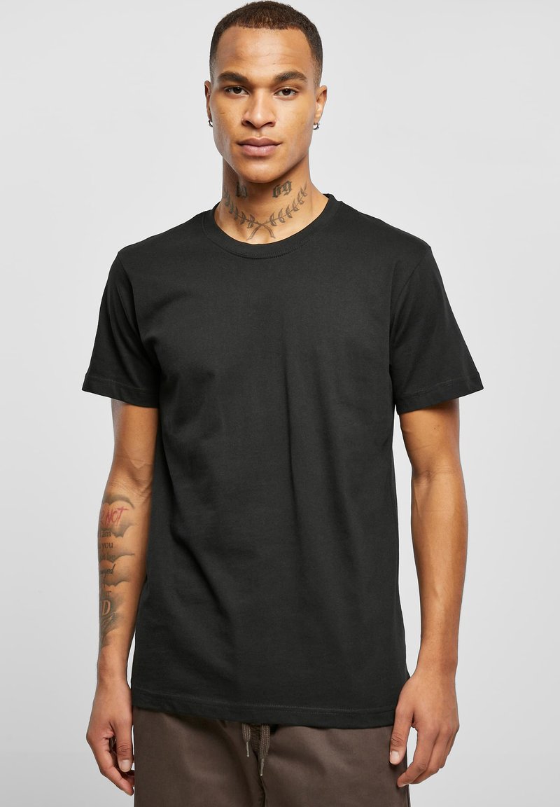 Sort bomulds T-shirt med korte ærmer, rund halsudskæring og en afslappet pasform. Har en glat tekstur, ingen mønstre eller udsmykninger.