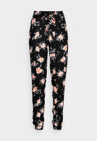 Blommiga byxor i svart tyg, med dragsko i midjan, avsmalnande benslut, och ett mönster av orange och blå blommor med gröna blad.