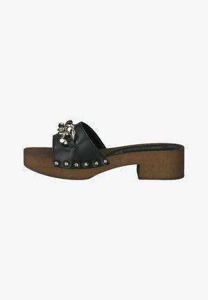 Black leather slide sandal with decorative metallic accents, wooden block heel, open toe, and studded detailing along the front.