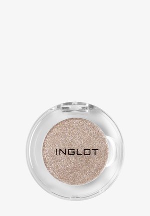 Compact rond clair unique avec fard à paupières beige scintillant étiqueté Inglot sur fond blanc.