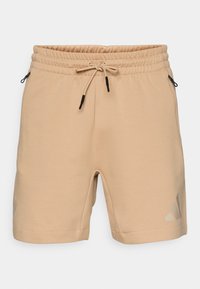 Korte sportsbukser - warm sandstone