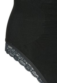 Black high-waisted shape short made of ribbed material, featuring a lace trim along the bottom edge and smooth textured panels.