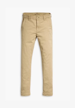 Chino beige en coton, avec une coupe droite, des poches avant et arrière, et une fermeture à bouton avec passants de ceinture.