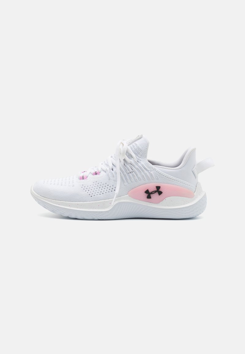White athletic sneaker with pink accent and black Under Armour logo, knit upper, and white sole shown from left side.