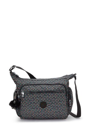 Sac bandoulière avec motif géométrique multicolore, poche zippée à l'avant, poche zippée sur le côté, bandoulière noire réglable et accessoire pompon noir attaché.