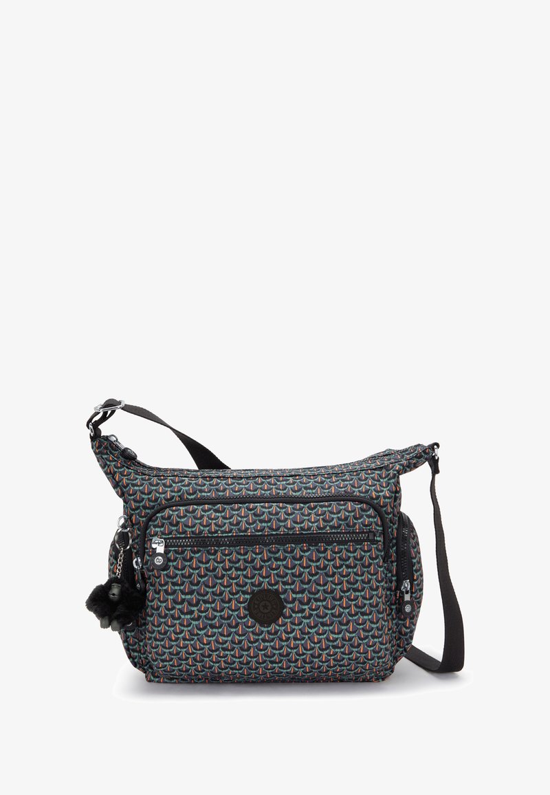 Treková taška přes rameno s multibarevným geometrickým vzorem, přední kapsa na zip, boční kapsa na zip, nastavitelné černé rameno a připojený černý pom-pom jako dekorace.