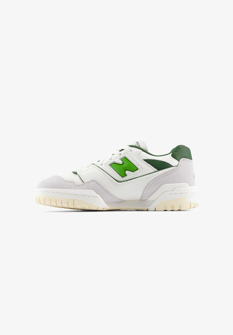 White sneaker with green accents, made of leather and suede. Features a textured upper, padded collar, and a rubber sole with visible tread.