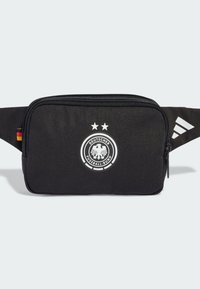 Black fabric waist bag with a zip closure, featuring a white German football emblem and two stars, and accented with a black Adidas stripe.